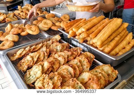 Various Types Of Fried Bread Sticks Or You Tiao At Hawker Stall