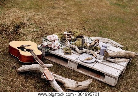 An Impromptu Wedding Table For Two On The Shores Of Mountain, On The Grass In Iceland. A Table Of Co