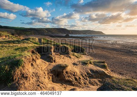 Beautiful Summer Sunset Landscape Image Of Widemouth Bay In Devon England With Golden Hour Light On 