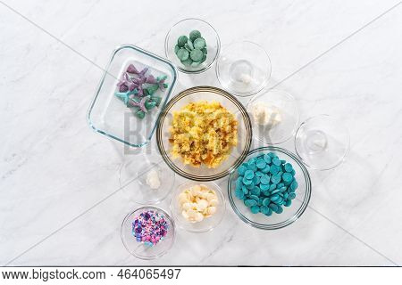 Flat Lay. Measured Ingredients In Glass Bowls To Prepare Mermaid Cakesicles.