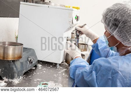 Scientist Embedding Tissues In Paraffin Blocks For Sectioning. Pathology Laboratory. Cancer Diagnosi