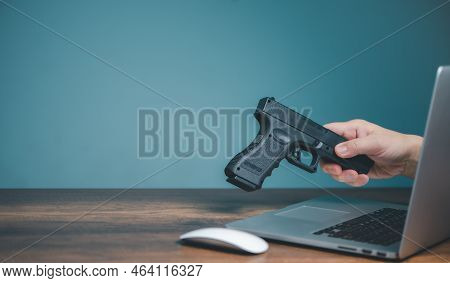 Buying Handgun From Online Seller Shop, Hands Of Seller Sending Handgun On Computer To Buying Handgu