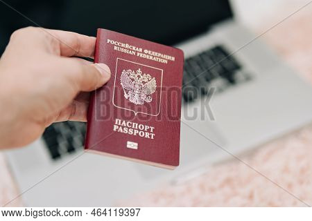 Russian Foreign International Passport In The Hand Citizen. Russian Citizenship, Passport And Rights