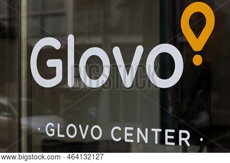 Glovo's Logo On The Glass At The Glovo Stationary Point.