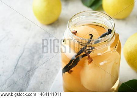 Canned Pear Compote With Vanillin. Pear Compote. Homemade Delicious Canned Pear Compote In Glass Jar