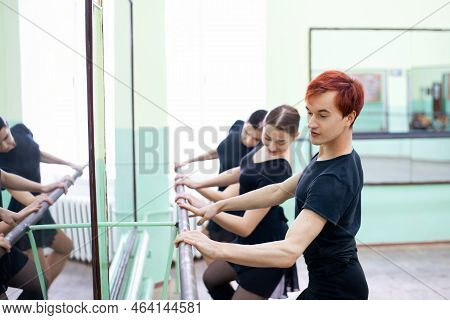Group Of Professional Dancers Learning New Elements In The Dancing Studio Near The Mirror. Learning 