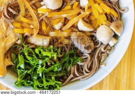 Korean Noodles, Ramyeon Or Ramyun With Spicy Taste, Topped With Egg Yolk, Chili, Mushrooms, Egg Yolk