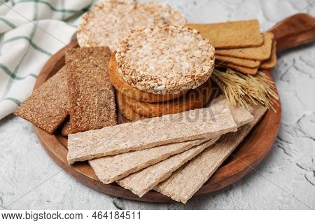 Rye Crispbreads, Rice Cakes And Rusks On White Textured Table