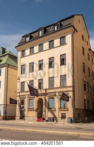 Sweden, Stockholm - July 17, 2022: Closeup Of Hotel Gamla Stan Yellow Classic Building On Skeppsbron