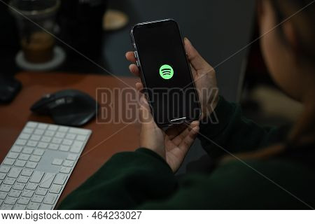 Chiang Mai, Thailand - Oct 05, 2022: Woman Holding Smart Phone With Spotify On Screen. Spotify Is A 