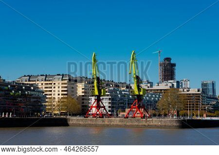 Buenos Aires, Argentina. September 04, 2022. Big Old Cranes In Puerto Madero Neighborhood Waterfront