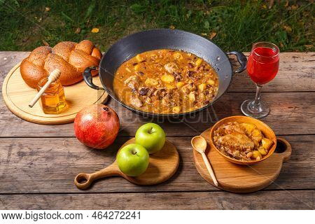 Festive Table On Rosh Hashanah Hot Cholent, Pomegranate, Wine, Honey, Apples, Challah Horizontal Pho