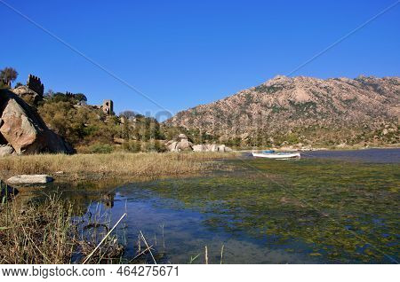 Fishing Boats Moored Along The Shore Of Lake Bafa In Turkey.