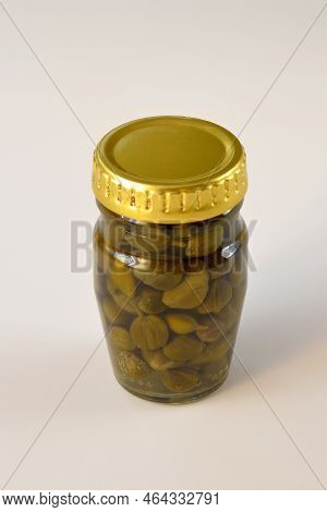 Jar With Pickled Capers On White Background
