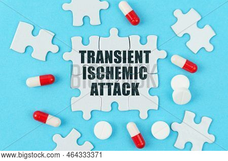 Medical Concept. On A Blue Background, Pills, Capsules And Puzzles With The Inscription - Transient 