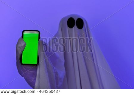 The Ghost Shows A Phone With A Green Screen. Phone With Chromakey. The Ghost Makes An Order From Sma