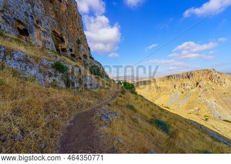 View Of Ancient Hiding Caves On A Cliff, And Mount Nitai, In Mount Arbel National Park, Northern Isr