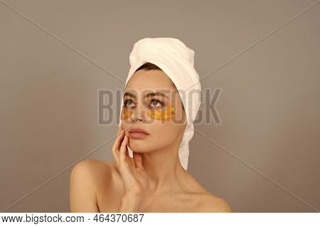 The Softest Skin. Moisturizing Skin. Cosmetology. Young Woman In Terry Towel Use Patch.
