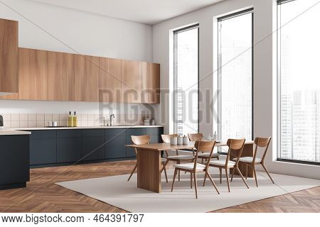 Corner View On Bright Kitchen Room Interior With Dining Table, Chairs, Cupboard, White Wall, Hardwoo