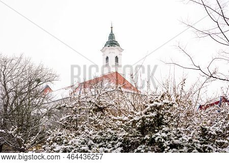 Winter. Ahnd Snow. Franciscan Church In Vác.