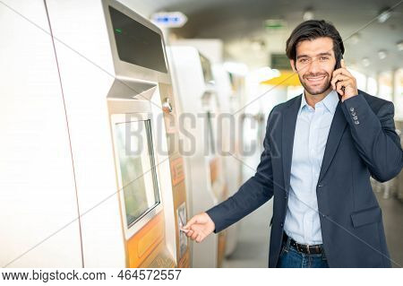 The Caucasian Man Use A Transport Card At The Ticket Machine For Travel By Sky Train In The Rush Hou