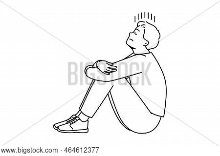 Unhappy Young Man Sit On Floor Suffer From Loneliness And Repetitive Thoughts. Stressed Male Struggl