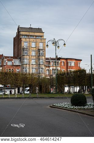 Jette, Brussels Capital Region, Belgium - 10 28 2022 - The Belgica Roundabout With Commercial Houses