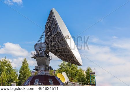 Soviet Satellite Dish Antenna Orbita Against Blue Sky Background. Old Equipment For Telecommunicatio