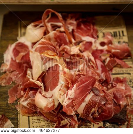 Lots Of Ham Slices Piled On A Board.