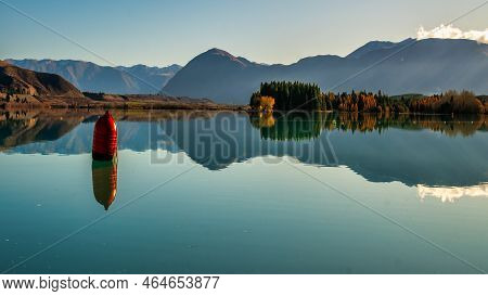 Single Solitary Red Buoy Marking The Rowing Course At Lake Ruataniwha Along With The Southern Alps M