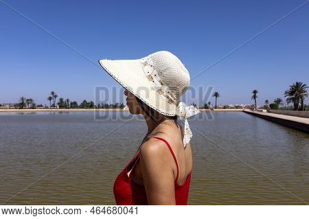 Sexy Tourist Woman Strolling Through The Gardens And The Lake Of The Almenara Where The Fortress Is