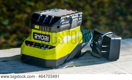 Norwalk, Ct, Usa - November 2, 2022: Ryobi Battery Charger  With Battery On Table Outside