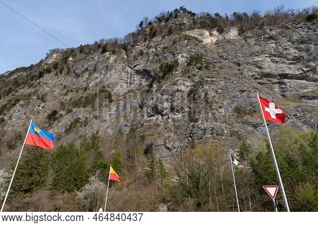 Balzers, Liechtenstein, April 11, 2022 Waving National Flags At The Border Between Liechtenstein And