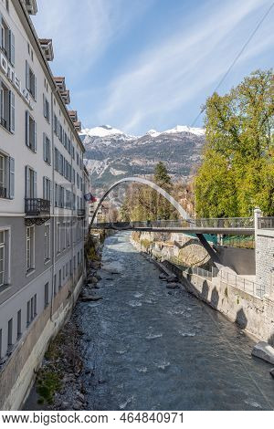 Chur, Switzerland, April 11, 2022 Modern Plessur Bridge With A Bow Over The Small River In The City 