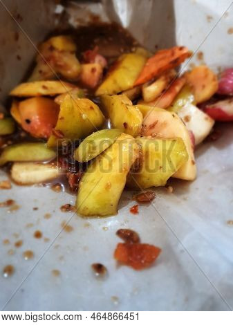 Close Up Photo Of Fruit Salad Covered With Rujak Seasoning With Palm Sugar And Chili.