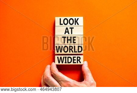 Look At The World Wider Symbol. Concept Words Look At The World Wider On Wooden Blocks On A Beautifu