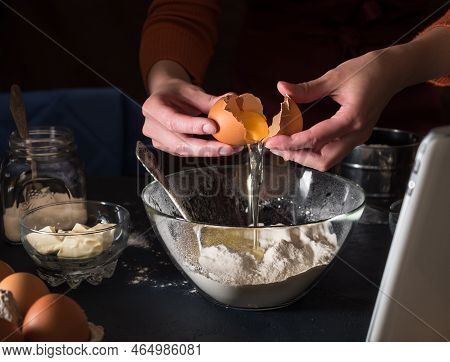 Cooking A Cake According To The Recipe. We Look At The Recipe In The Tablet. On The Table Are Ingred