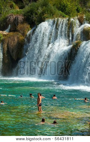 KRKA NATIONAL PARK, CROATIA - JUL 28: Tourists swimming in a river on July 28, 2012 in Krka National Park, Croatia. One of the most famous Croatian tourist attractions.