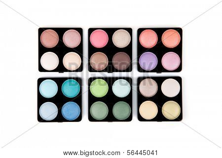 Six eyeshadow palettes isolated on white