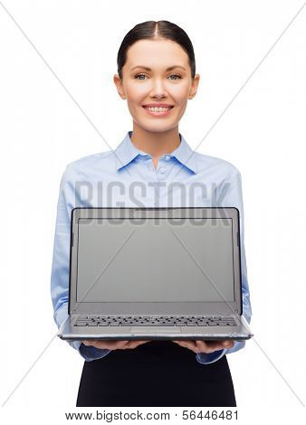 business, technology, internet and advetising concept - friendly young smiling businesswoman with laptop blank screen
