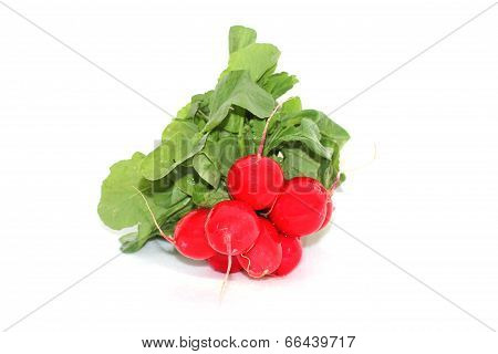 Fresh Red Radishes With Green Leaves On A White Background