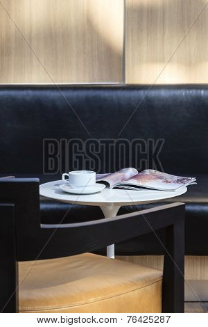 Coffee and Book on Table in Cafe Coffee Shop