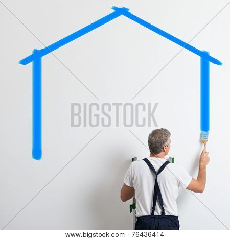 Painter On Stepladder Painting Wall With Brush In New House