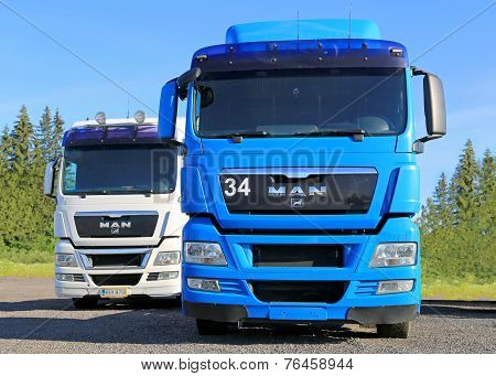 White And Blue Man Truck Tractors