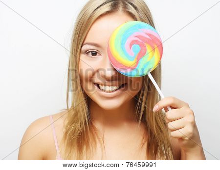 Nice blond girl with lolipop. Closed eye.