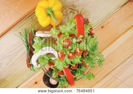 fresh salad and cherry's on wooden table