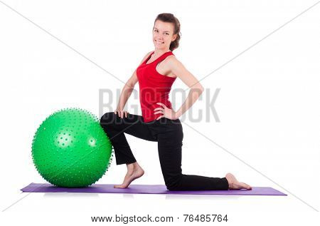 Young woman exercising with swiss ball