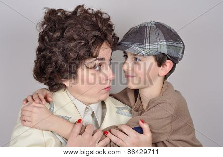 Son hugging his angry mother