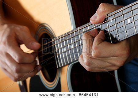 Acoustic Guitar Player Performing Song