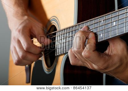 Acoustic Guitar Player Performing Song